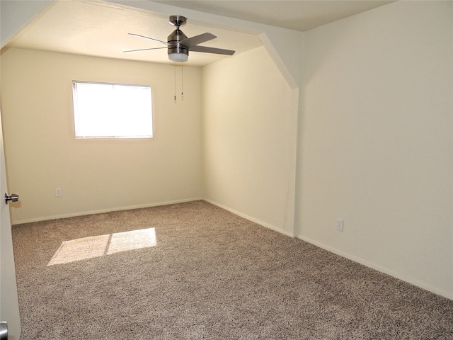 empty room featuring ceiling fan and carpet flooring