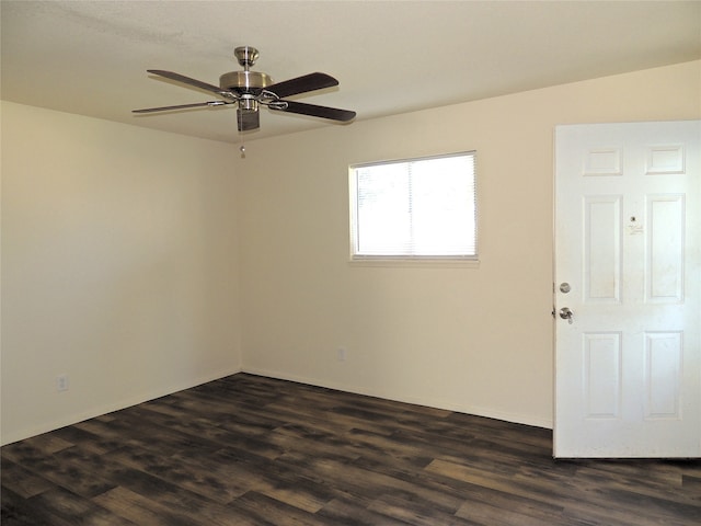 unfurnished room with dark hardwood / wood-style floors and ceiling fan