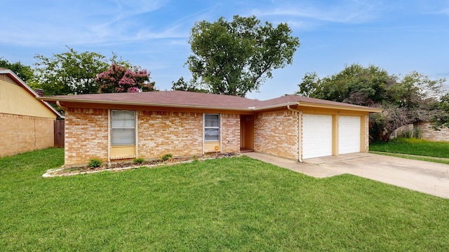 single story home with a front yard and a garage