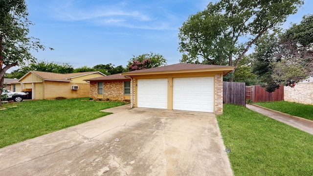 view of front of property featuring a front lawn and a garage