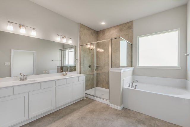 bathroom featuring tile patterned floors, separate shower and tub, and vanity