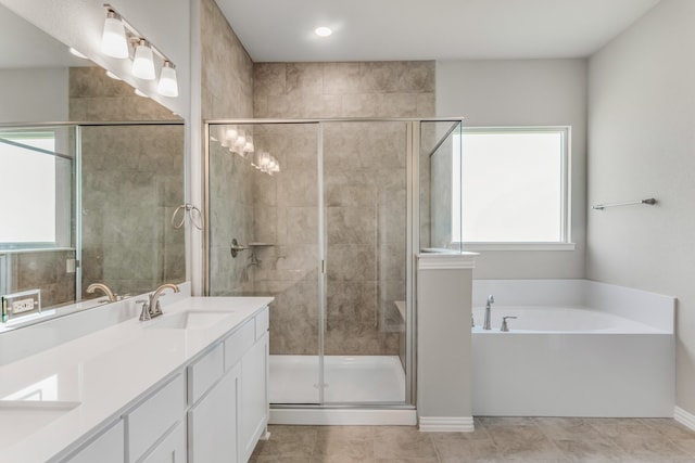 bathroom with vanity, plus walk in shower, and tile patterned flooring