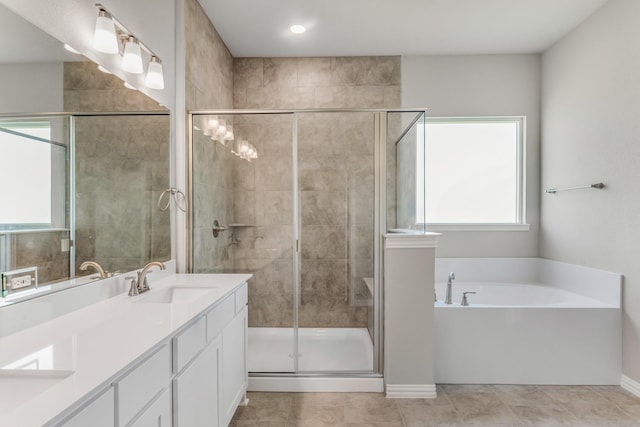 180 Roosevelt Ln, Valley View, TX 76272 - bathroom featuring a shower stall, a garden tub, a sink, and plenty of natural light