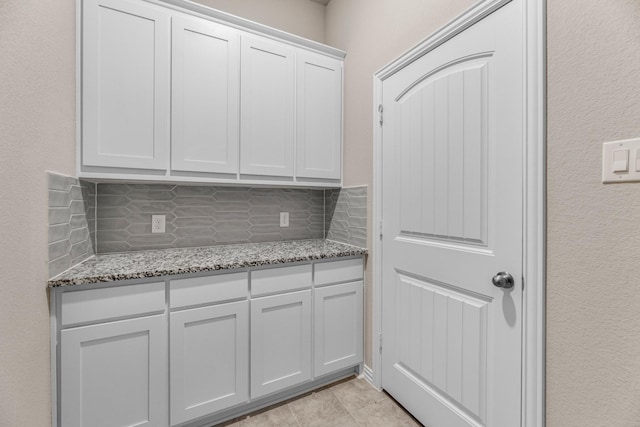 180 Roosevelt Ln, Valley View, TX 76272 - laundry area with light tile patterned floors