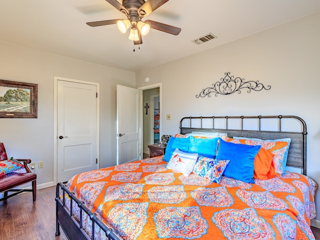 bedroom with ceiling fan and hardwood / wood-style flooring