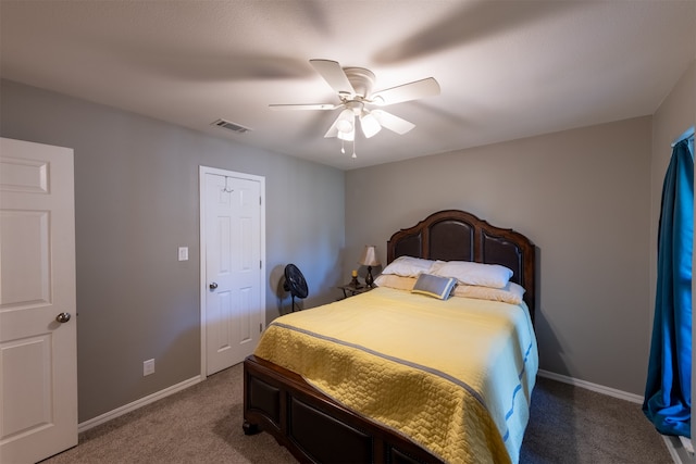 bedroom with ceiling fan, a closet, and carpet flooring