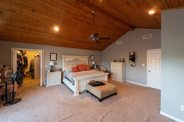 carpeted bedroom featuring ceiling fan, high vaulted ceiling, a closet, a spacious closet, and wooden ceiling