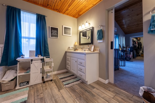 bathroom with vanity, hardwood / wood-style floors, vaulted ceiling, and wooden ceiling