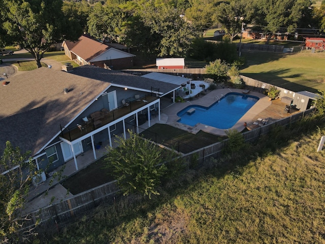 view of swimming pool with a patio and a lawn