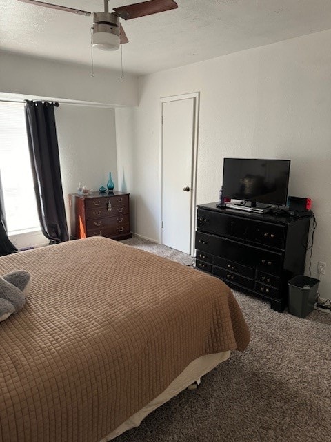 bedroom featuring ceiling fan and light colored carpet