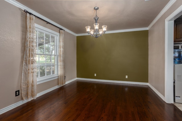 spare room with an inviting chandelier, dark hardwood / wood-style floors, and ornamental molding