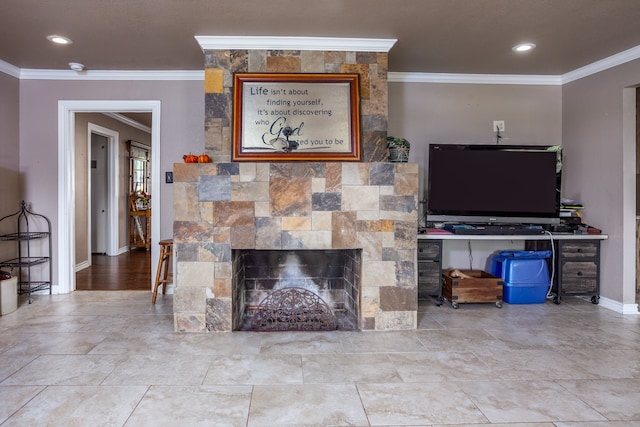 living room with a fireplace and crown molding