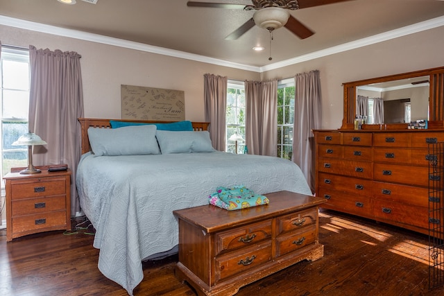 bedroom with ornamental molding, ceiling fan, and dark hardwood / wood-style flooring