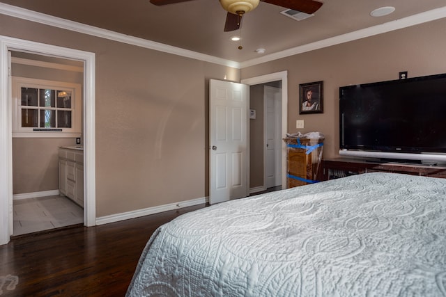 bedroom featuring ceiling fan, ensuite bathroom, crown molding, and dark wood-type flooring