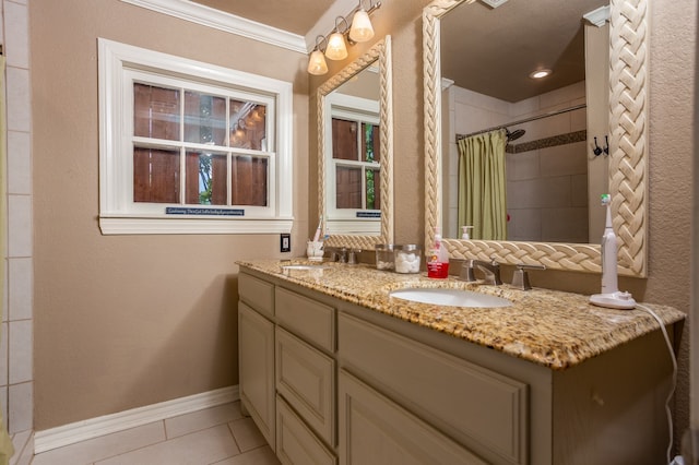 bathroom with tile patterned flooring, walk in shower, vanity, and crown molding