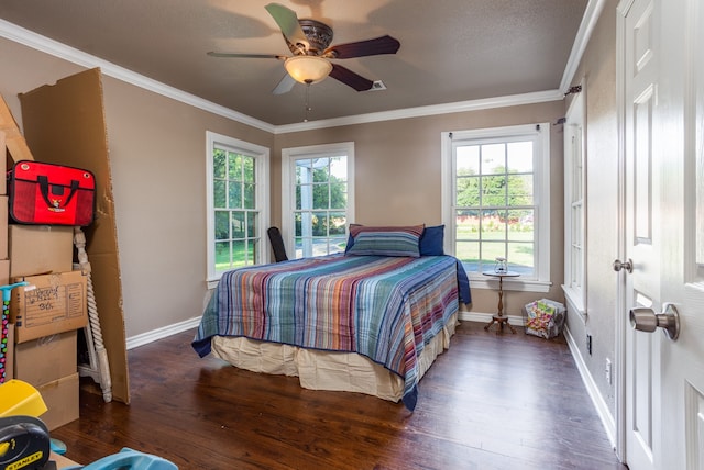 bedroom with a textured ceiling, ceiling fan, dark hardwood / wood-style floors, and crown molding