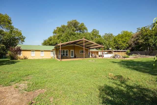 rear view of house with a lawn