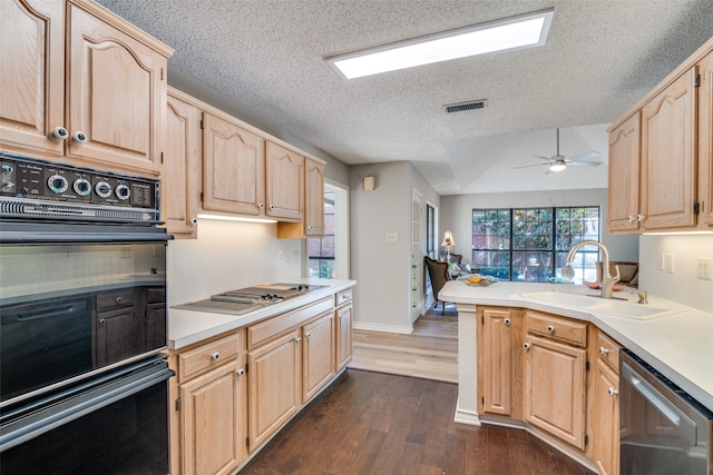 kitchen featuring light brown cabinets, dark hardwood / wood-style flooring, stainless steel appliances, ceiling fan, and sink