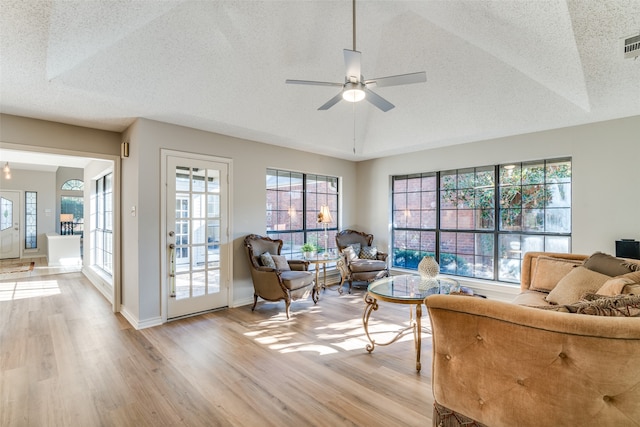 interior space with light hardwood / wood-style floors, plenty of natural light, and ceiling fan