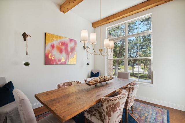 dining area featuring a notable chandelier, dark wood-type flooring, beam ceiling, and a wealth of natural light