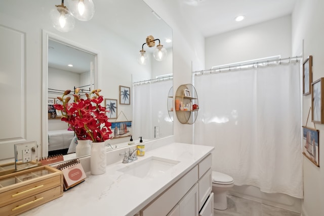 full bathroom with shower / tub combo, tile patterned flooring, vanity, and toilet