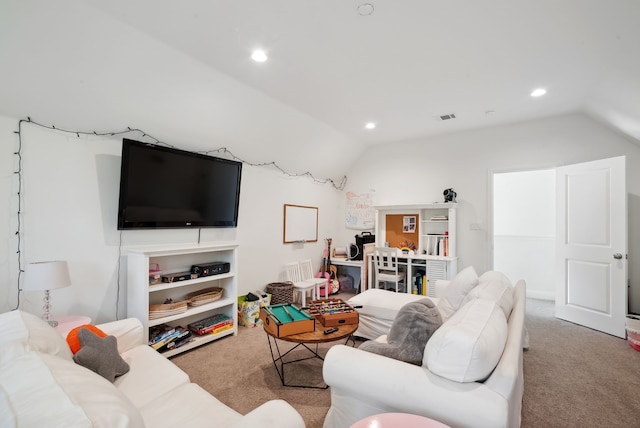 carpeted living room featuring vaulted ceiling