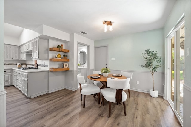 dining space with light hardwood / wood-style floors