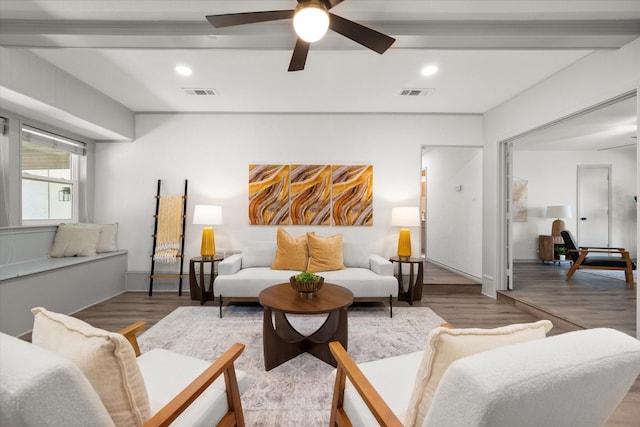 living room with wood-type flooring, beam ceiling, and ceiling fan