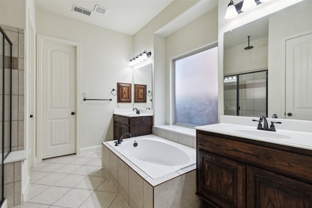 bathroom featuring shower with separate bathtub, tile patterned flooring, and vanity