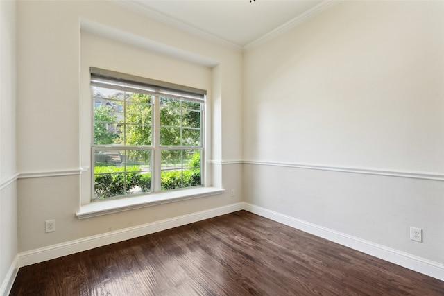 unfurnished room featuring ornamental molding and hardwood / wood-style flooring