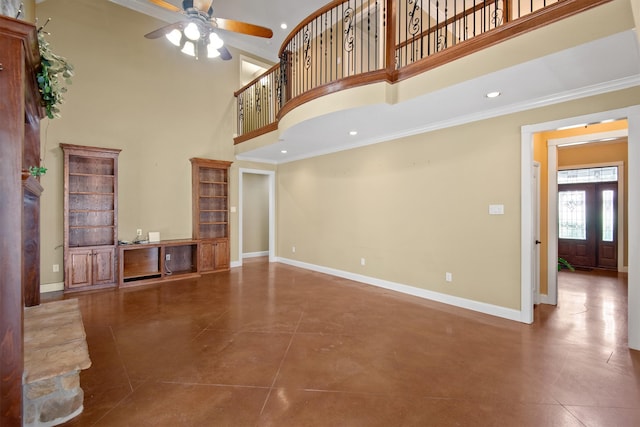 unfurnished living room featuring crown molding, a high ceiling, ceiling fan, and tile patterned floors