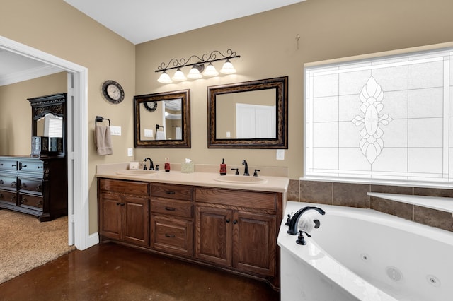 bathroom featuring a healthy amount of sunlight, vanity, concrete flooring, and a relaxing tiled tub