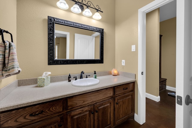 bathroom featuring hardwood / wood-style flooring and vanity