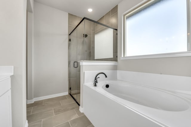 bathroom with plus walk in shower and vanity