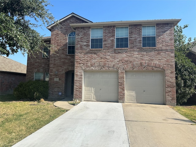 view of front of home featuring a front yard and a garage