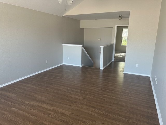 empty room with dark wood-type flooring