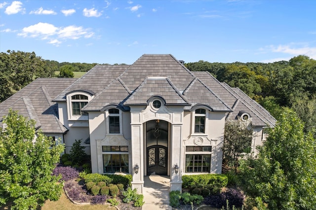 french provincial home featuring french doors