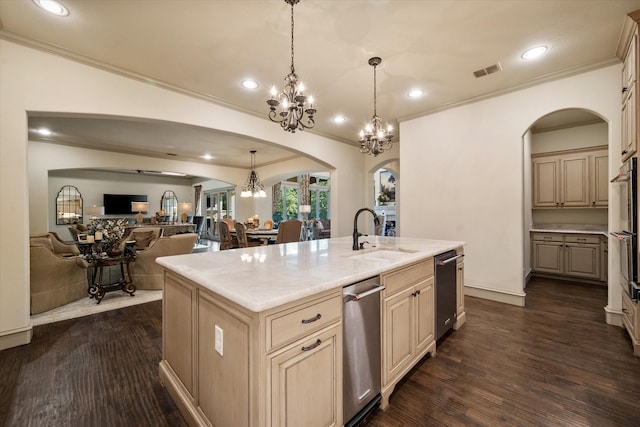 kitchen featuring dark wood-type flooring, a kitchen island with sink, sink, hanging light fixtures, and ornamental molding