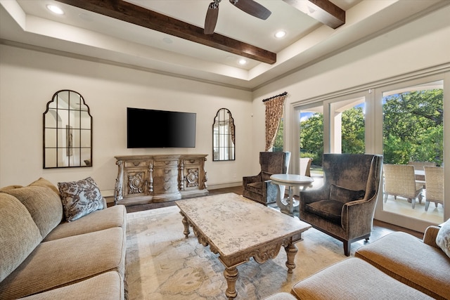 living room featuring wood-type flooring, ceiling fan, and beamed ceiling