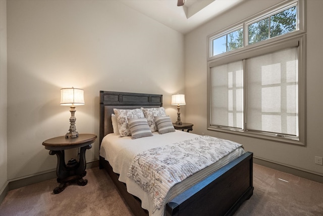 bedroom with dark carpet and ceiling fan