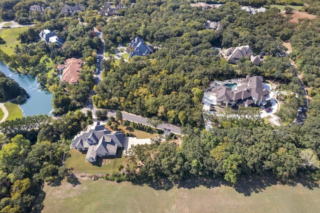 birds eye view of property featuring a water view