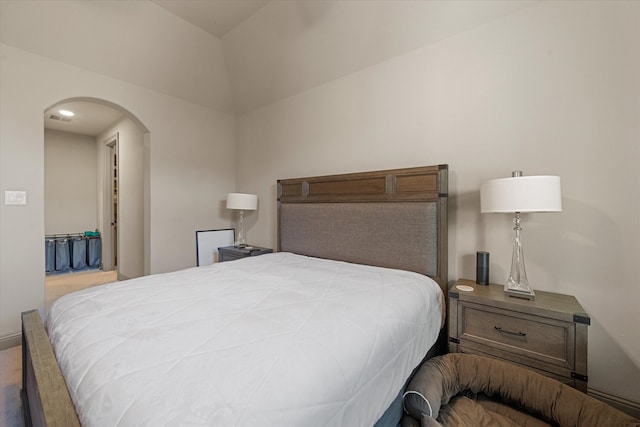 bedroom featuring vaulted ceiling