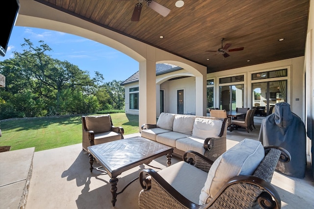 view of patio with an outdoor living space and ceiling fan