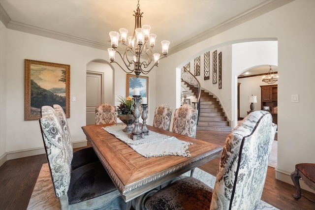 dining area with dark hardwood / wood-style floors and crown molding