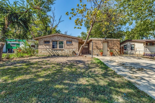 ranch-style home featuring a front lawn and a patio area