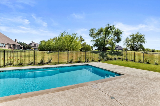 view of swimming pool with a patio and a lawn