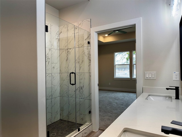 bathroom featuring an enclosed shower and vanity