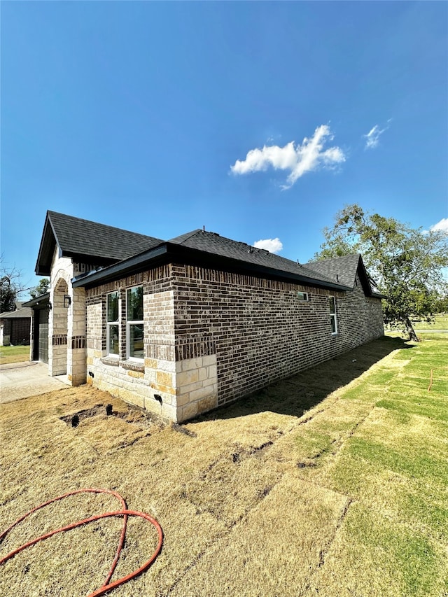 view of home's exterior with a yard