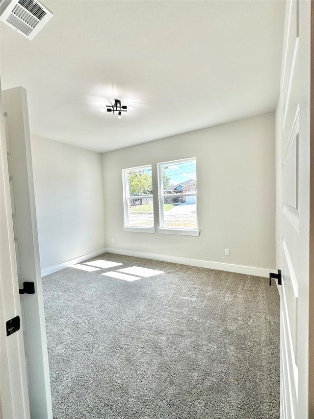 unfurnished room featuring carpet flooring