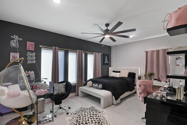 bedroom featuring light carpet and ceiling fan